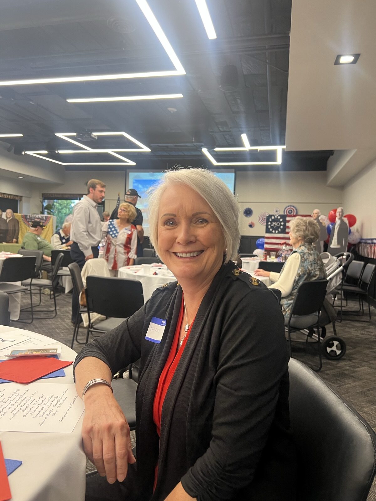 A guest smiles at her table during Missoula County Republicans' Celebrate America dinner.