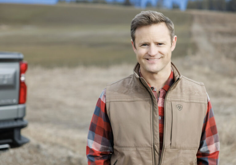 Aaron Flint, Republican nominee for Montana’s 1st Congressional District, standing in a Montana field.